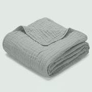 Morvelle Sage muslin cotton blanket folded on white